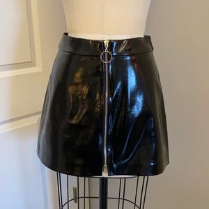 Black pleather skirt with front zipper. XS Zara
